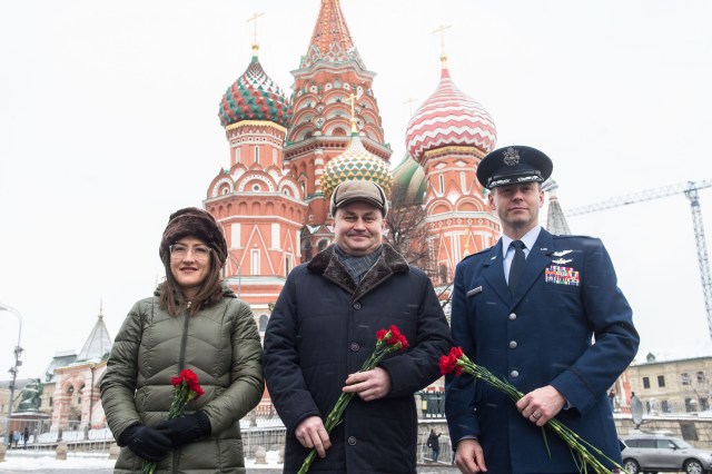 With St. Basil’s Cathedral in Red Square in Moscow providing a wintry backdrop, Expedition 59 crew members Christina Koch of NASA (left), Alexey Ovchinin of Roscosmos (center) and Nick Hague of NASA (right) pose for pictures Feb. 21 prior to the ceremonial laying of flowers at the Kremlin Wall. They will launch March 14, U.S. time, on the Soyuz MS-12 spacecraft from the Baikonur Cosmodrome in Kazakhstan for a six-and-a-half month mission on the International Space Station.
