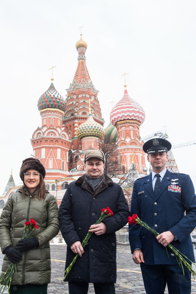 With St. Basil’s Cathedral in Red Square in Moscow providing a wintry backdrop, Expedition 59 crew members Christina Koch of NASA (left), Alexey Ovchinin of Roscosmos (center) and Nick Hague of NASA (right) pose for pictures Feb. 21 prior to the ceremonial laying of flowers at the Kremlin Wall. They will launch March 14, U.S. time, on the Soyuz MS-12 spacecraft from the Baikonur Cosmodrome in Kazakhstan for a six-and-a-half month mission on the International Space Station.
