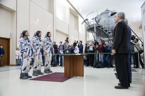 At the Gagarin Cosmonaut Training Center in Star City, Russia, Expedition 59 crew members Christina Koch of NASA (left), Alexey Ovchinin of Roscosmos (center) and Nick Hague of NASA (right) report to Russian space officials Feb. 20 during the second day of final pre-launch qualifications exams. They will launch March 14, U.S. time, in the Soyuz MS-12 spacecraft from the Baikonur Cosmodrome in Kazakhstan for a six-and-a-half month mission on the International Space Station.