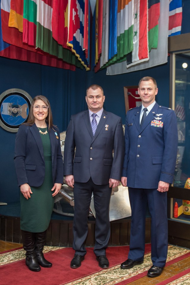 At the Gagarin Museum in the Gagarin Cosmonaut Training Center in Star City, Russia, Expedition 59 crew members Christina Koch of NASA (left), Alexey Ovchinin of Roscosmos (center) and Nick Hague of NASA (right) pose for pictures Feb. 21 following a pre-launch news conference. They will launch March 14, U.S. time, on the Soyuz MS-12 spacecraft from the Baikonur Cosmodrome in Kazakhstan for a six-and-a-half month mission on the International Space Station.