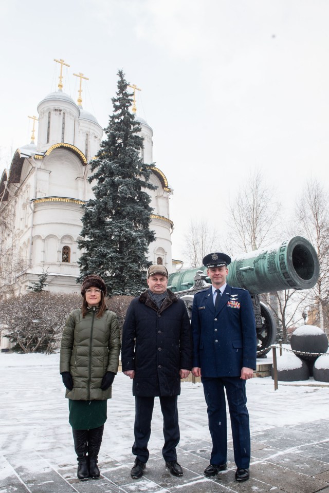 Inside the Kremlin in Moscow, Expedition 59 crew members Christina Koch of NASA (left), Alexey Ovchinin of Roscosmos (center) and Nick Hague of NASA (right) pose for pictures in front of the Tsar Cannon on a wintry day Feb. 21 as part of their pre-launch activities. They will launch March 14, U.S. time, on the Soyuz MS-12 spacecraft from the Baikonur Cosmodrome in Kazakhstan for a six-and-a-half month mission on the International Space Station.