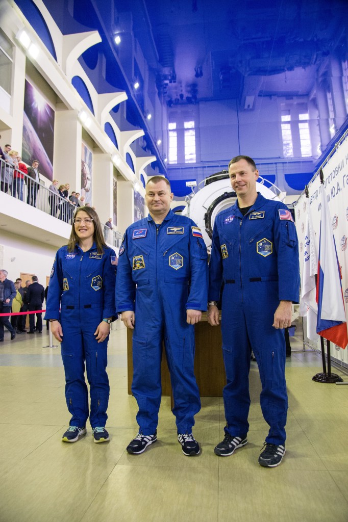 At the Gagarin Cosmonaut Training Center in Star City, Russia, Expedition 59 crew members Christina Koch of NASA (left), Alexey Ovchinin of Roscosmos (center) and Nick Hague of NASA (right) pose for pictures Feb. 19 during the first of two days of final pre-launch qualification exams. They will launch March 14, U.S. time, from the Baikonur Cosmodrome in Kazakhstan on the Soyuz MS-12 spacecraft for a six-and-a-half month mission on the International Space Station.