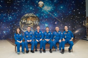At the Baikonur Cosmodrome Museum in Kazakhstan, a model of the world’s first satellite, Sputnik, serves as a hanging backdrop March 10 as the Expedition 59 prime and backup crew members pose for pictures in traditional pre-launch activities. From left to right are the prime crewmembers, Christina Koch of NASA, Alexey Ovchinin of Roscosmos and Nick Hague of NASA, and the backup crewmembers, Drew Morgan of NASA, Alexander Skvortsov of Roscosmos and Luca Parmitano of the European Space Agency. Koch, Hague and Ovchinin will launch March 14, U.S. time, in the Soyuz MS-12 spacecraft from the Baikonur Cosmodrome for a six-and-a-half month mission on the International Space Station.