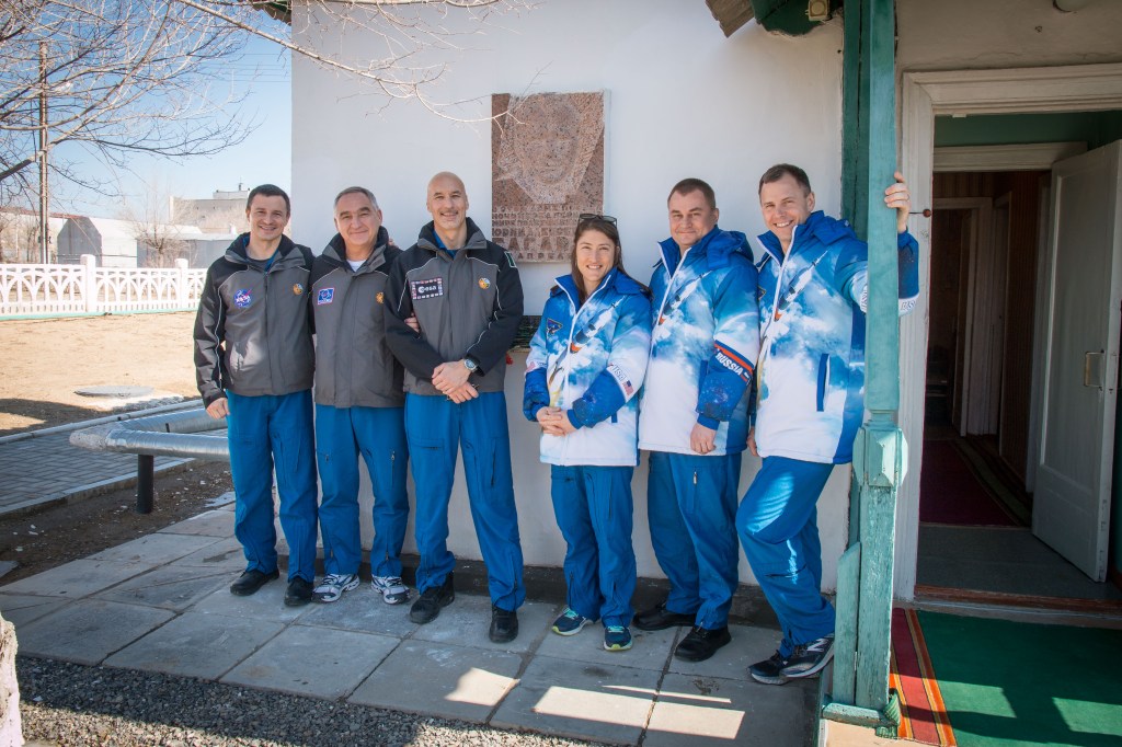 jsc2019e013423 (March 10, 2019) --- At the Baikonur Cosmodrome in Kazakhstan, the Expedition 59 backup and prime crew members pose for pictures March 10 outside the cottage that Yuri Gagarin slept in the night before his historic mission April 12, 1961 to become the first human to fly in space. From left to right are the backup crew members, Drew Morgan of NASA, Alexander Skvortsov of Roscosmos and Luca Parmitano of the European Space Agency, and the prime crew members, Christina Koch of NASA, Alexey Ovchinin of Roscosmos and Nick Hague of NASA, who will launch March 14, U.S. time, in the Soyuz MS-12 spacecraft from the Baikonur Cosmodrome for a six-and-a-half month mission on the International Space Station.