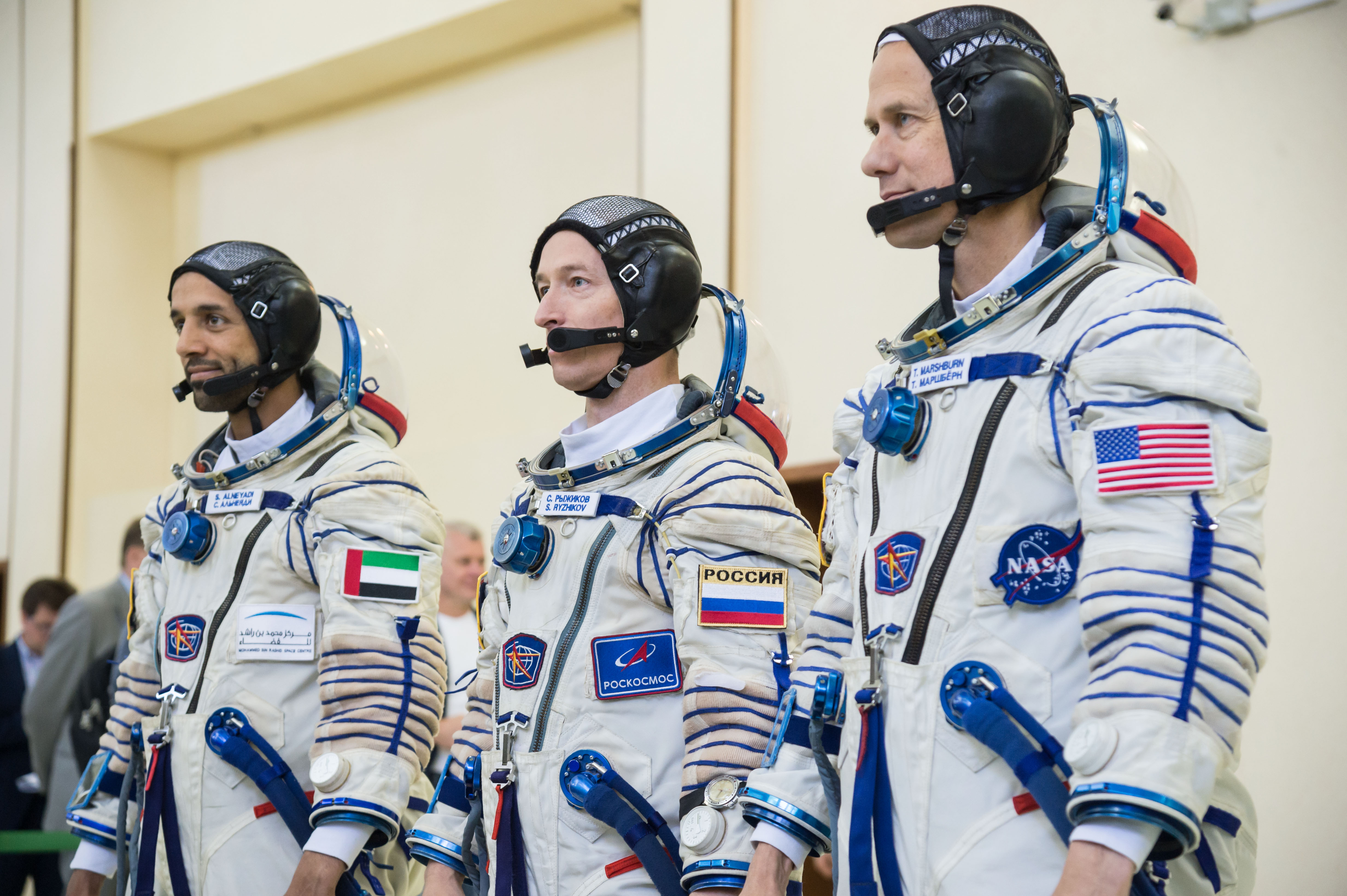 At the Gagarin Cosmonaut Training Center in Star City, Russia, the backups to the next crew to launch to the International Space Station report for duty Aug. 29 during the first day of crew qualification exams. From left to right are backup spaceflight participant Sultan Al-Neyadi of the United Arab Emirates, Sergey Ryzhikov of Roscosmos and Tom Marshburn of NASA. They are the backups to the prime crew, spaceflight participant Hazzaa Ali Almansoori of the United Arab Emirates and Expedition 61 crewmembers Oleg Skripochka of Roscosmos and Jessica Meir of NASA, who will launch Sept. 25 from the Baikonur Cosmodrome in Kazakhstan on the Soyuz MS-15 spacecraft.
