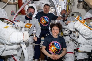 Flight Engineers Christina Koch and Oleg Skripochka are pictured assisting spacewalkers Andrew Morgan (left) and Luca Parmitano (right) in the U.S. Quest airlock before they would begin the second spacewalk to repair the Alpha Magnetic Spectrometer's thermal control system.