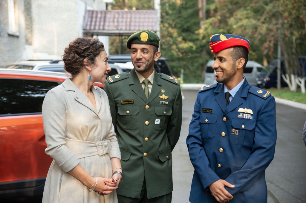 At the Gagarin Cosmonaut Training Center in Star City, Russia, Expedition 61 crewmember Jessica Meir of NASA (left) chats with backup spaceflight participant Sultan Al-Neyadi of the United Arab Emirates (center) and prime spaceflight participant Hazzaa Ali Almansoori of the United Arab Emirates (right) Sept. 10 before departing for their launch site at the Baikonur Cosmodrome in Kazakhstan. Meir, Oleg Skripochka of Roscosmos and Almansoori will launch on Sept. 25 from the Baikonur Cosmodrome on the Soyuz MS-15 spacecraft for a mission on the International Space Station.