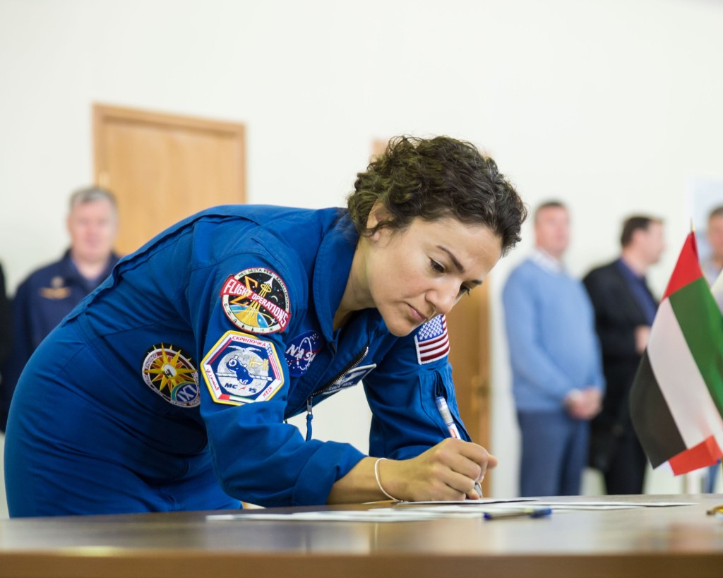At the Gagarin Cosmonaut Training Center in Star City, Russia, Expedition 61 crewmember Jessica Meir of NASA signs in for the first day of crew qualification exams Aug. 29. Meir, Oleg Skripochka of Roscosmos and United Arab Emirates spaceflight participant Hazzaa Ali Almansoori will launch Sept. 25 from the Baikonur Cosmodrome in Kazakhstan on the Soyuz MS-15 spacecraft for a mission on the International Space Station.