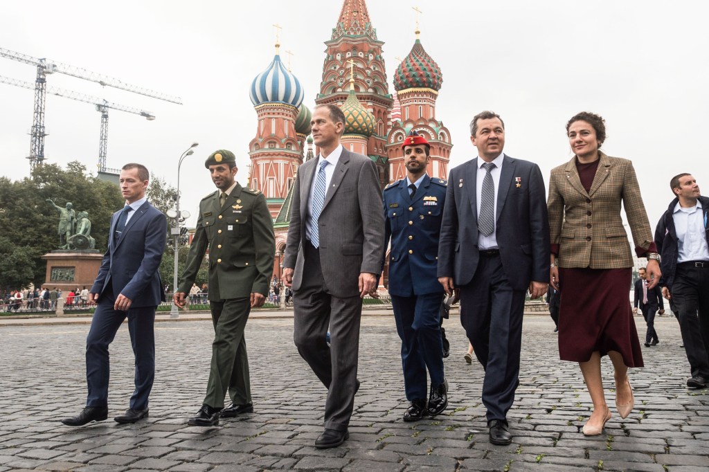 With St. Basil’s Cathedral serving as a backdrop, the next crew to launch to the International Space Station and their backups walk through Red Square in Moscow Sept. 5 as part of traditional pre-launch activities. From right to left are Expedition 61 crewmembers Jessica Meir of NASA and Oleg Skripochka of Roscosmos, spaceflight participant Hazzaa Ali Almansoori of the United Arab Emirates and backups, Tom Marshburn of NASA, Sultan Al-Neyadi of the United Arab Emirates and Sergey Ryzhikov of Roscosmos. Meir, Skripochka and Almansoori will launch Sept. 25 from the Baikonur Cosmodrome in Kazakhstan on the Soyuz MS-15 spacecraft for a mission on the International Space Station.