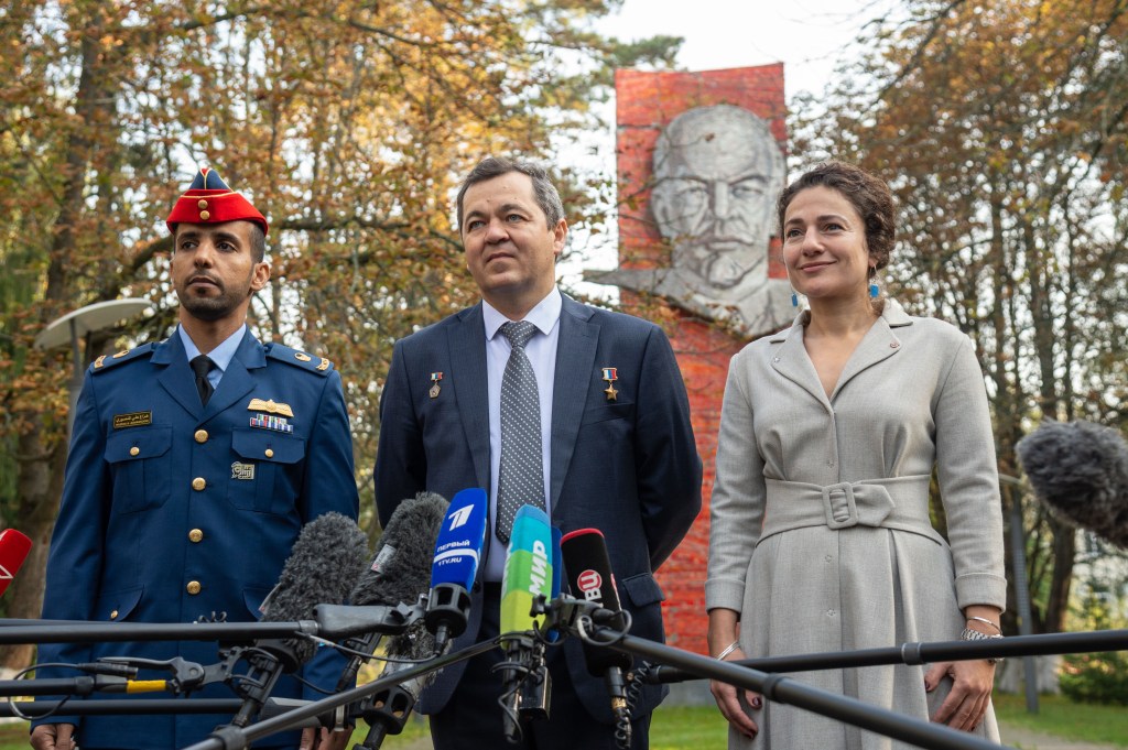 At the Gagarin Cosmonaut Training Center in Star City, Russia, the image of Vladimir Lenin serves as a backdrop as spaceflight participant Hazzaa Ali Almansoori of the United Arab Emirates (left) and Expedition 61 crewmembers Oleg Skripochka of Roscosmos (center) and Jessica Meir of NASA (right) answer reporters' question Sept. 10 before traveling to a nearby airfield for a flight to their launch site at the Baikonur Cosmodrome in Kazakhstan. They will launch on Sept. 25 from the Baikonur Cosmodrome on the Soyuz MS-15 spacecraft for a mission on the International Space Station.