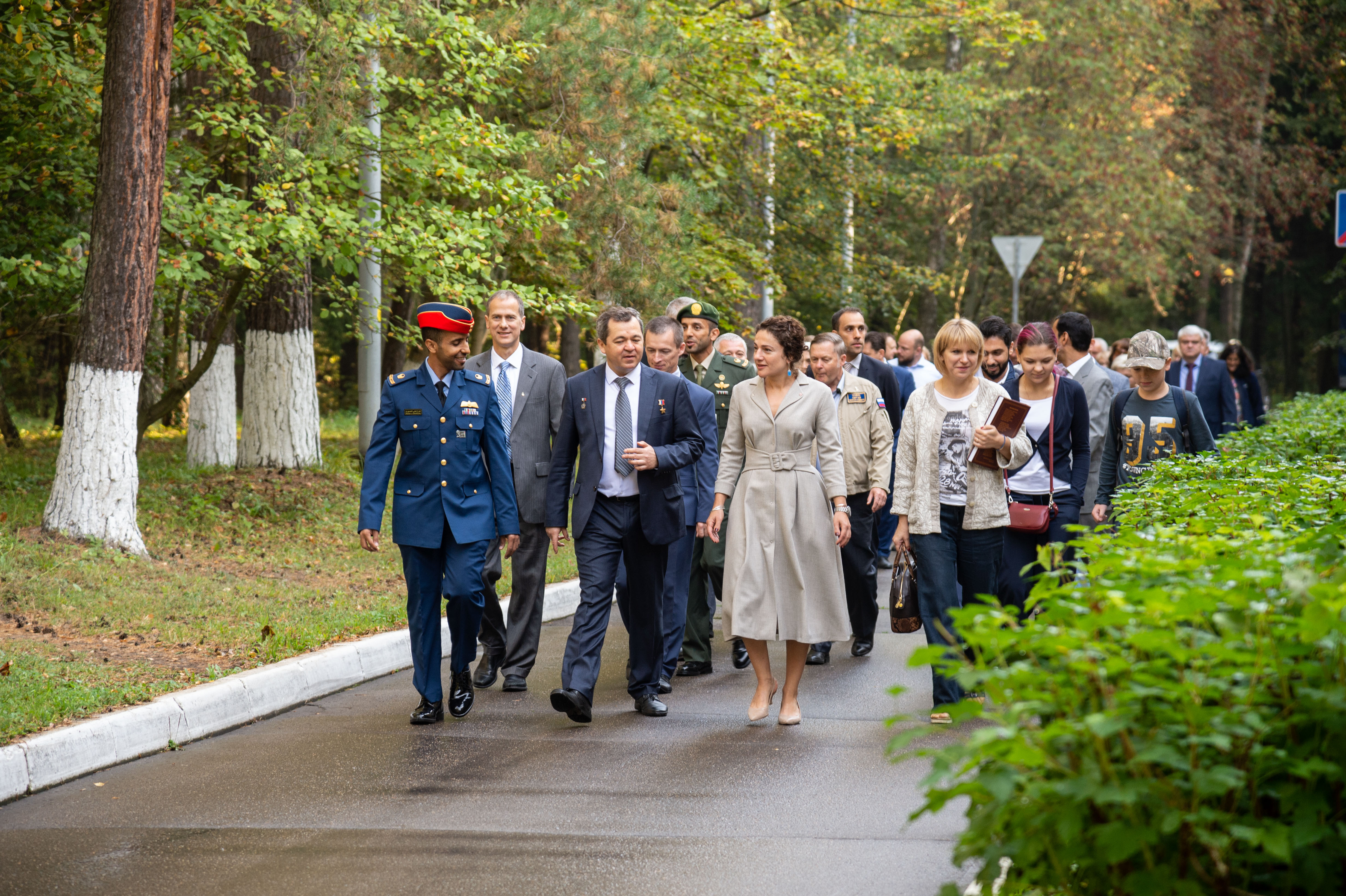 At the Gagarin Cosmonaut Training Center in Star City, Russia, spaceflight participant Hazzaa Ali Almansoori of the United Arab Emirates (front, left) and Expedition 61 crewmembers Oleg Skripochka of Roscosmos (center) and Jessica Meir of NASA (right) lead the way Sept. 10 as they walk to the busses that will take them to a nearby airfield for a flight to their launch site at the Baikonur Cosmodrome in Kazakhstan. They will launch on Sept. 25 from the Baikonur Cosmodrome on the Soyuz MS-15 spacecraft for a mission on the International Space Station.