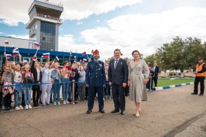 At the airport in Baikonur, Kazakhstan, spaceflight participant Hazzaa Ali Almansoori of the United Arab Emirates (left) and Expedition 61 crewmembers Oleg Skripochka of Roscosmos (center) and Jessica Meir of NASA (right) pose for pictures Sept. 10 upon their arrival at the launch site for final pre-launch training. They will launch on Sept. 25 from the Baikonur Cosmodrome on the Soyuz MS-15 spacecraft for a mission on the International Space Station.