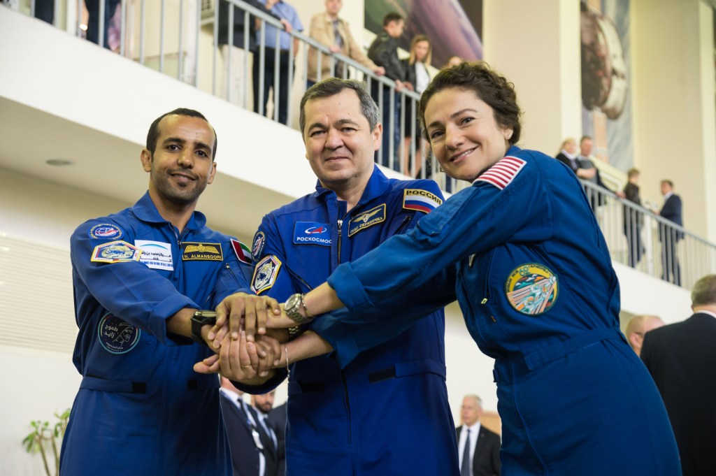 At the Gagarin Cosmonaut Training Center in Star City, Russia, the next crew to launch to the International Space Station posed for pictures Aug. 29, during their final qualification exams for flight. From left to right are, United Arab Emirates spaceflight participant Hazzaa Ali Almansoori, and Expedition 61 crewmembers Oleg Skripochka of Roscosmos, and Jessica Meir of NASA. They will launch Sept. 25, from the Baikonur Cosmodrome in Kazakhstan on the Soyuz MS-15 spacecraft.