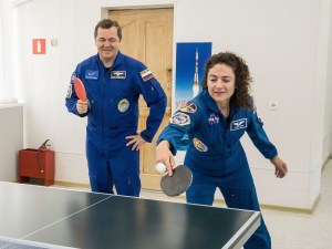 At the Cosmonaut Hotel crew quarters in Baikonur, Kazakhstan, Expedition 61 crewmembers Oleg Skripochka of Roscosmos (left) and Jessica Meir of NASA (right) share a game of ping-pong Sept. 18 as part of pre-launch activities. Along with spaceflight participant Hazzaa Ali Almansoori of the United Arab Emirates, they will launch Sept. 25 from the Baikonur Cosmodrome in Kazakhstan on the Soyuz MS-15 spacecraft for a mission on the International Space Station.