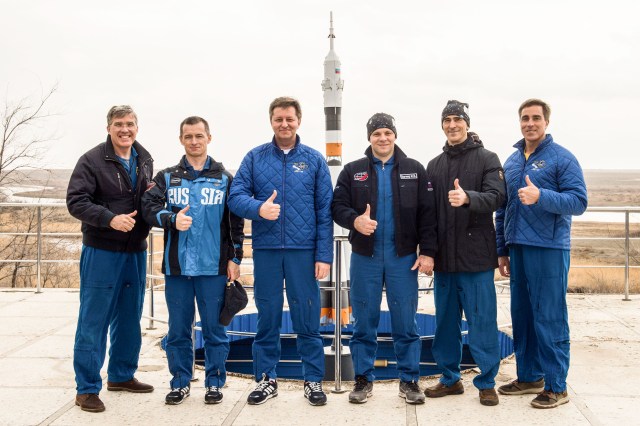 At the Cosmonaut Hotel crew quarters in Baikonur, Kazakhstan, Expedition 63 backup and prime crewmembers pose for pictures April 1 as part of pre-launch activities. From left to right are backup crewmembers Steve Bowen of NASA and Sergey Ryzhikov and Andrei Babkin of Roscosmos and prime crewmembers Ivan Vagner and Anatoly Ivanishin of Roscosmos and Chris Cassidy of NASA. Vagner, Ivanishin and Cassidy will launch April 9 on the Soyuz MS-16 spacecraft from the Baikonur Cosmodrome in Kazakhstan for a six-and-a-half month mission on the International Space Station.