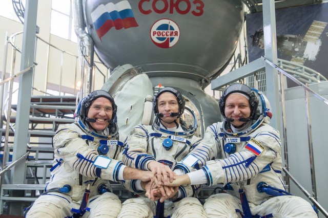 At the Gagarin Cosmonaut Training Center in Star City, Russia, Expedition 63 backup crewmembers Steve Bowen of NASA (left) and Sergey Ryzhikov (center) and Andrei Babkin of Roscosmos (right) pose for pictures March during Soyuz qualification exams March 11. They are the backups to Chris Cassidy of NASA and Anatoly Ivanishin and Ivan Vagner of Roscosmos, who are scheduled to launch April 9 in the Soyuz MS-16 spacecraft from the Baikonur Cosmodrome in Kazakhstan for a six-and-a-half month mission on the International Space Station.