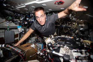 NASA astronaut and Expedition 63 Commander Chris Cassidy performs maintenance on the Combustion Integrated Rack, a research device that enables safe fuel, flame and soot studies in microgravity.
