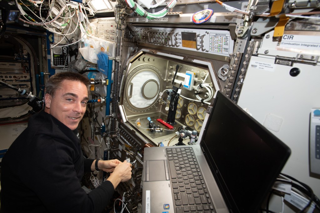 NASA astronaut and Expedition 63 Commander Chris Cassidy sets up the Microgravity Science Glovebox for a space bubbles experiment. The Electrolysis Measurement study is observing how bubbles inside microfluid systems may help produce oxygen on a spacecraft and deliver drugs though skin patches.