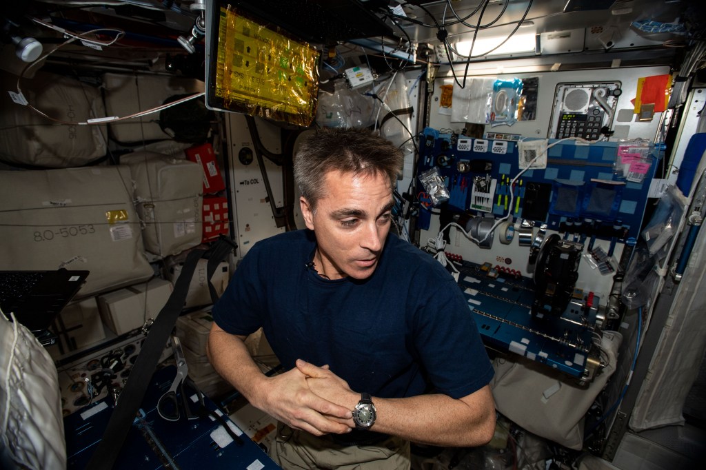 NASA astronaut and Expedition 63 Commander Chris Cassidy is pictured in the International Space Station's Harmony module working on maintenance tasks.