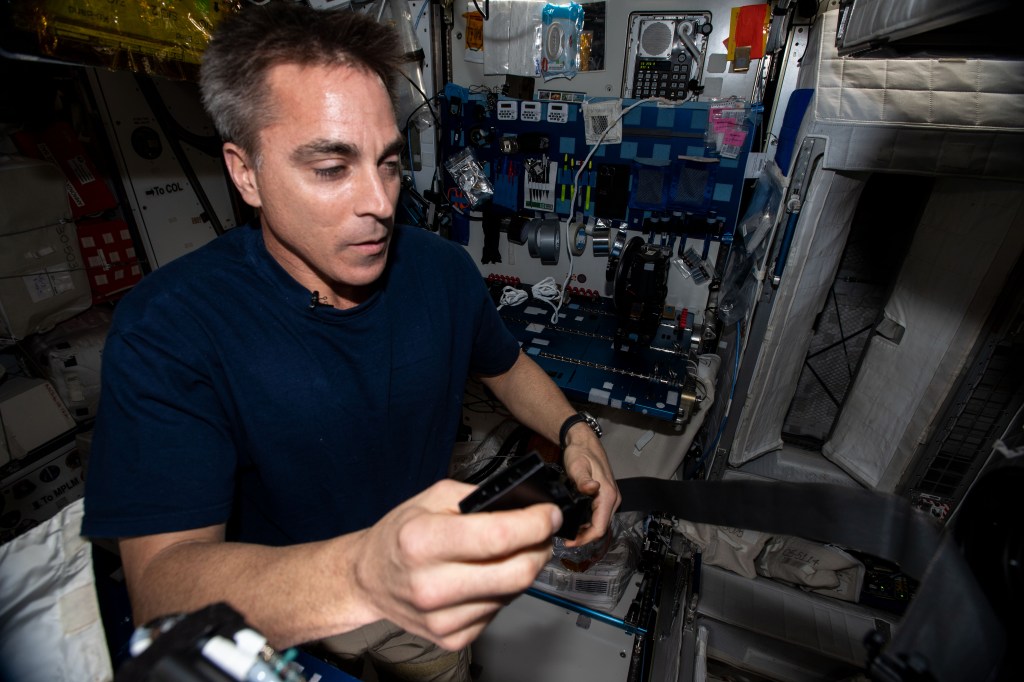NASA astronaut and Expedition 63 Commander Chris Cassidy is pictured in the International Space Station's Harmony module working on maintenance tasks.