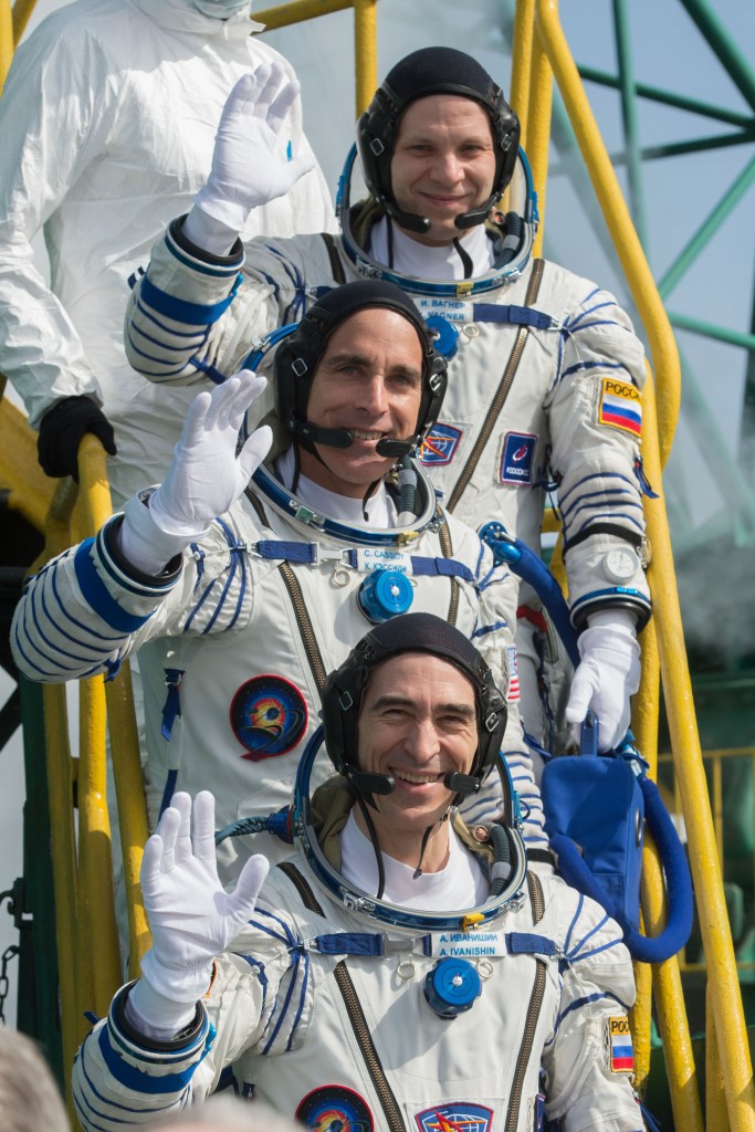 Expedition 63 Crew Waves Farewell - Expedition 63 crewmembers Ivan Vagner of Roscosmos, top, and Chris Cassidy of NASA wave goodbye as they and Anatoly Ivanishin of Roscosmos prepare to climb aboard the Soyuz MS-16 rocket at Site 31 at the Baikonur Cosmodrome in Kazakhstan, Thursday, April 9, 2020. They launched a short time later to the International Space Station for the start of a six-and-a-half month mission.