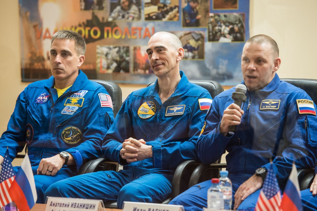 At the Cosmonaut Hotel crew quarters in Baikonur, Kazakhstan, Expedition 63 crewmember Ivan Vagner of Roscosmos (right) responds to questions provided by reporters in a virtual question and answer session April 8 as he prepares for launch. Vagner and Anatoly Ivanishin (center) of Roscosmos and Chris Cassidy (left) of NASA will launch April 9 on the Soyuz MS-16 spacecraft from the Baikonur Cosmodrome for a six-and-a-half month mission on the International Space Station.