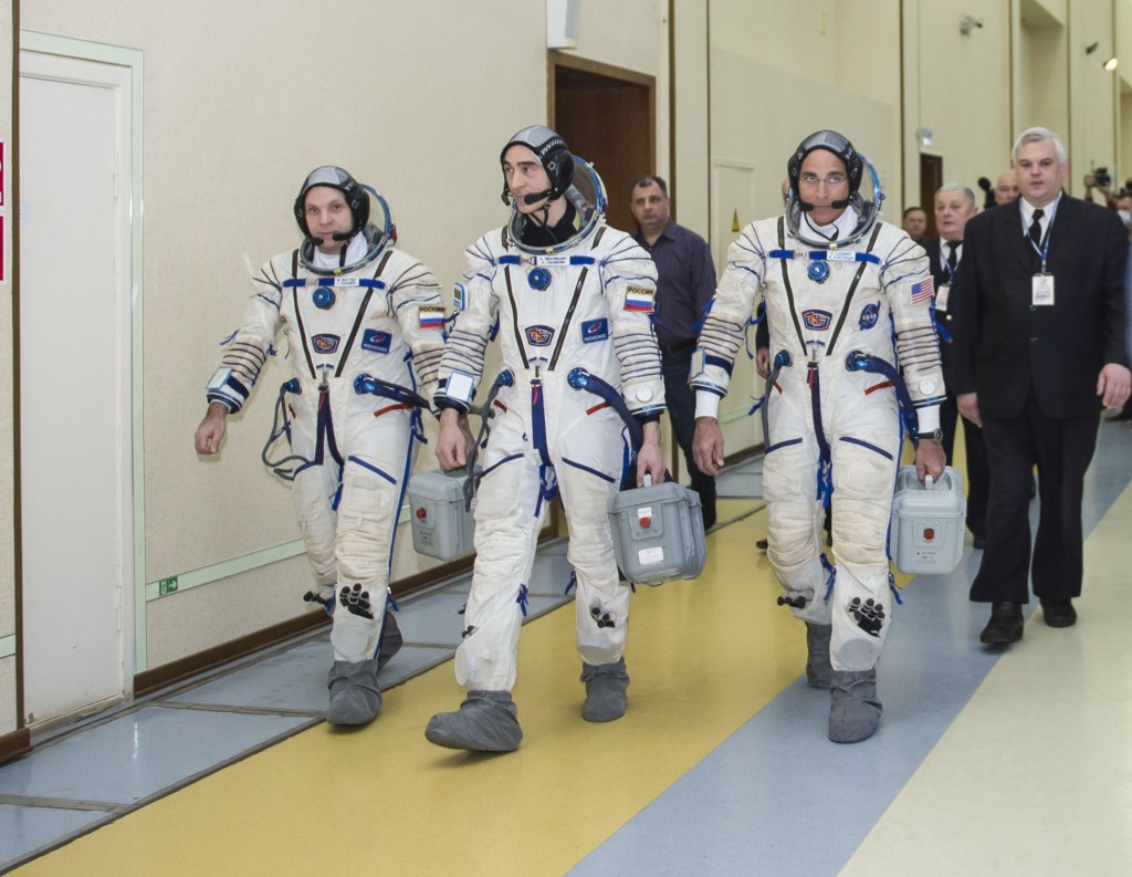 At the Gagarin Cosmonaut Training Center in Star City, Russia, Expedition 63 crewmembers Chris Cassidy of NASA (left) and Anatoly Ivanishin (center) and Ivan Vagner of Roscosmos (right) arrive for the second day of Soyuz qualification exams March 12. They are scheduled to launch April 9 on the Soyuz MS-16 spacecraft from the Baikonur Cosmodrome in Kazakhstan for a six-and-a-half month mission on the International Space Station.