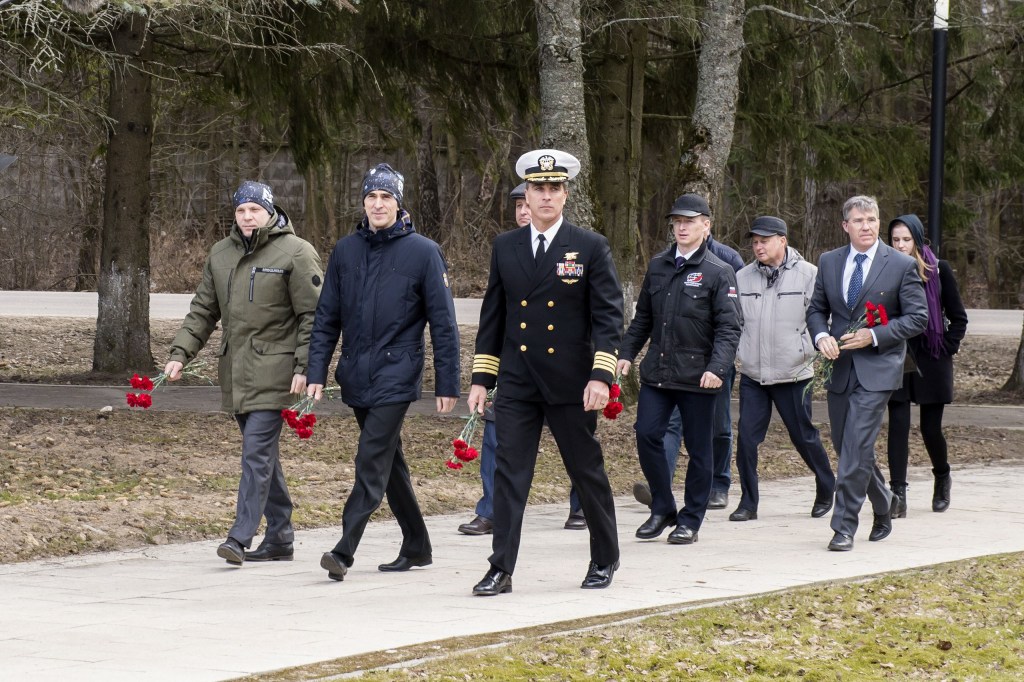 At the Gagarin Cosmonaut Training Center in Star City, Russia, Expedition 63 prime crewmembers Ivan Vagner (front left) and Anatoly Ivanishin (front center) of Roscosmos and NASA’s Chris Cassidy (front right) carry flowers March 23 to the statue of Yuri Gagarin, the first human to fly in space, as part of pre-launch activities. Behind them are the backup crewmembers, Andrey Babkin and Sergey Ryzhikov of Roscosmos and NASA’s Steve Bowen. Vagner, Ivanishin and Cassidy will launch April 9 on the Soyuz MS-16 spacecraft from the Baikonur Cosmodrome in Kazakhstan for a six-and-a-half month mission on the International Space Station.