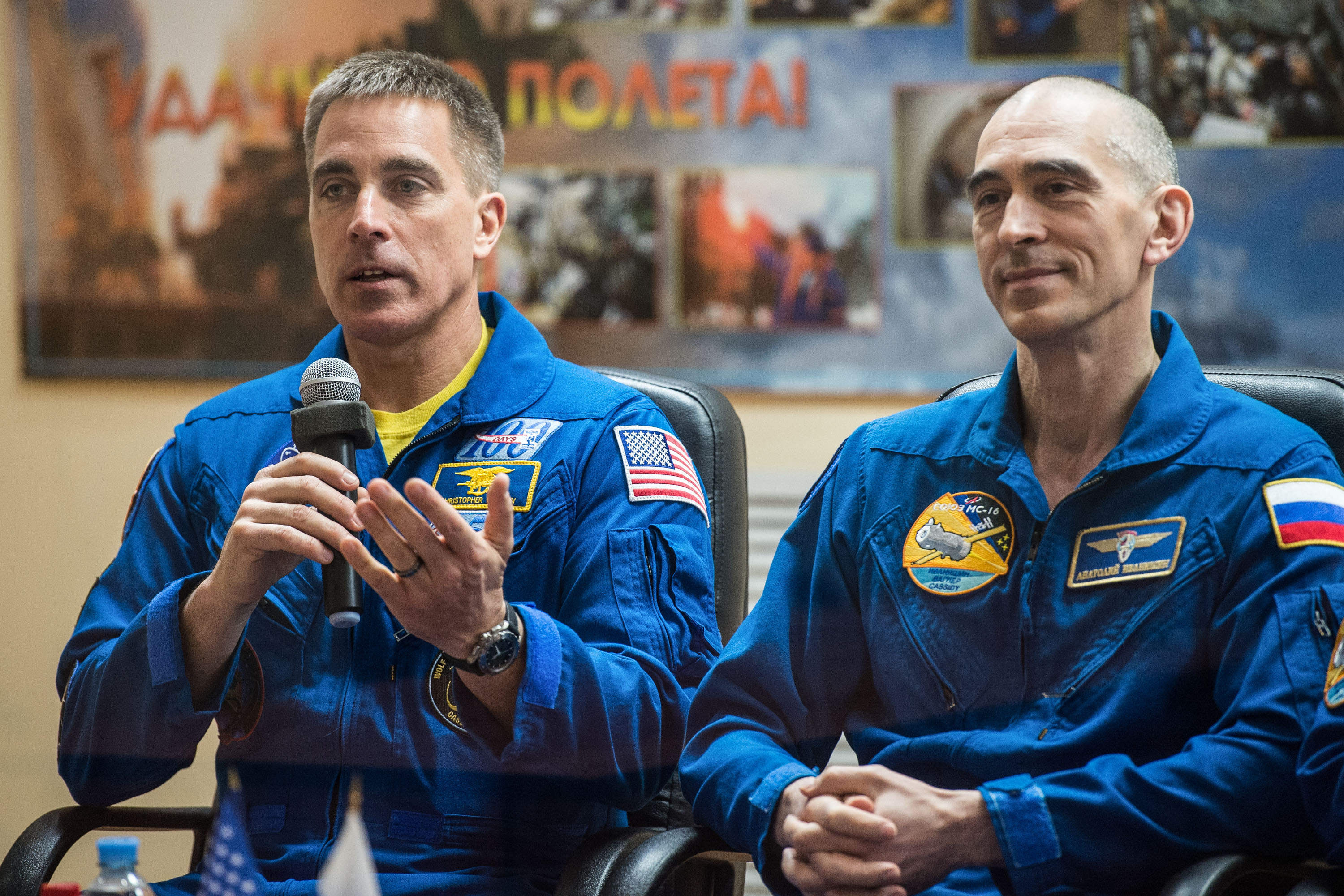 At the Cosmonaut Hotel crew quarters in Baikonur, Kazakhstan, Expedition 63 crewmember Chris Cassidy of NASA (left) responds to questions provided by reporters in a virtual question and answer session April 8 as he prepares for launch. Cassidy and Anatoly Ivanishin (right) and Ivan Vagner of Roscosmos will launch April 9 on the Soyuz MS-16 spacecraft from the Baikonur Cosmodrome for a six-and-a-half month mission on the International Space Station.