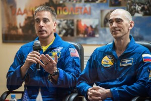 At the Cosmonaut Hotel crew quarters in Baikonur, Kazakhstan, Expedition 63 crewmember Chris Cassidy of NASA (left) responds to questions provided by reporters in a virtual question and answer session April 8 as he prepares for launch. Cassidy and Anatoly Ivanishin (right) and Ivan Vagner of Roscosmos will launch April 9 on the Soyuz MS-16 spacecraft from the Baikonur Cosmodrome for a six-and-a-half month mission on the International Space Station.