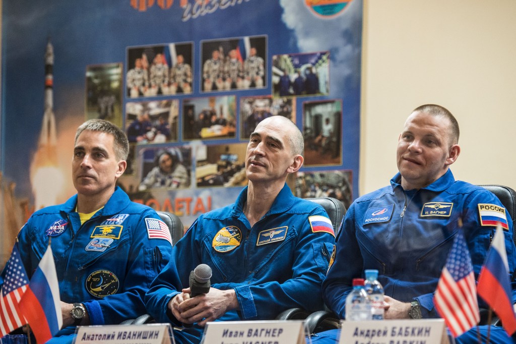 At the Cosmonaut Hotel crew quarters in Baikonur, Kazakhstan, Expedition 63 crewmembers Chris Cassidy of NASA (left) and Anatoly Ivanishin (center) and Ivan Vagner (right) of Roscosmos listen to questions provided by reporters in a virtual question and answer session April 8 as they prepare for launch. They will launch April 9 on the Soyuz MS-16 spacecraft from the Baikonur Cosmodrome for a six-and-a-half month mission on the International Space Station.