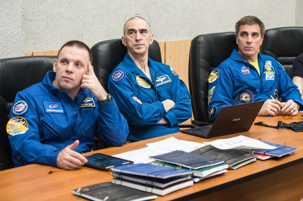 At the Cosmonaut Hotel crew quarters in Baikonur, Kazakhstan, Expedition 63 crewmembers Ivan Vagner (left) and Anatoly Ivanishin (center) of Roscosmos and Chris Cassidy of NASA (right) review launch procedures April 1. They will launch April 9 on the Soyuz MS-16 spacecraft from the Baikonur Cosmodrome in Kazakhstan for a six-and-a-half month mission on the International Space Station.