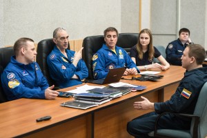 At the Cosmonaut Hotel crew quarters in Baikonur, Kazakhstan, Expedition 63 crewmembers Ivan Vagner (left) and Anatoly Ivanishin (center) of Roscosmos and Chris Cassidy of NASA (right) review launch procedures with trainers April 1. They will launch April 9 on the Soyuz MS-16 spacecraft from the Baikonur Cosmodrome in Kazakhstan for a six-and-a-half month mission on the International Space Station.