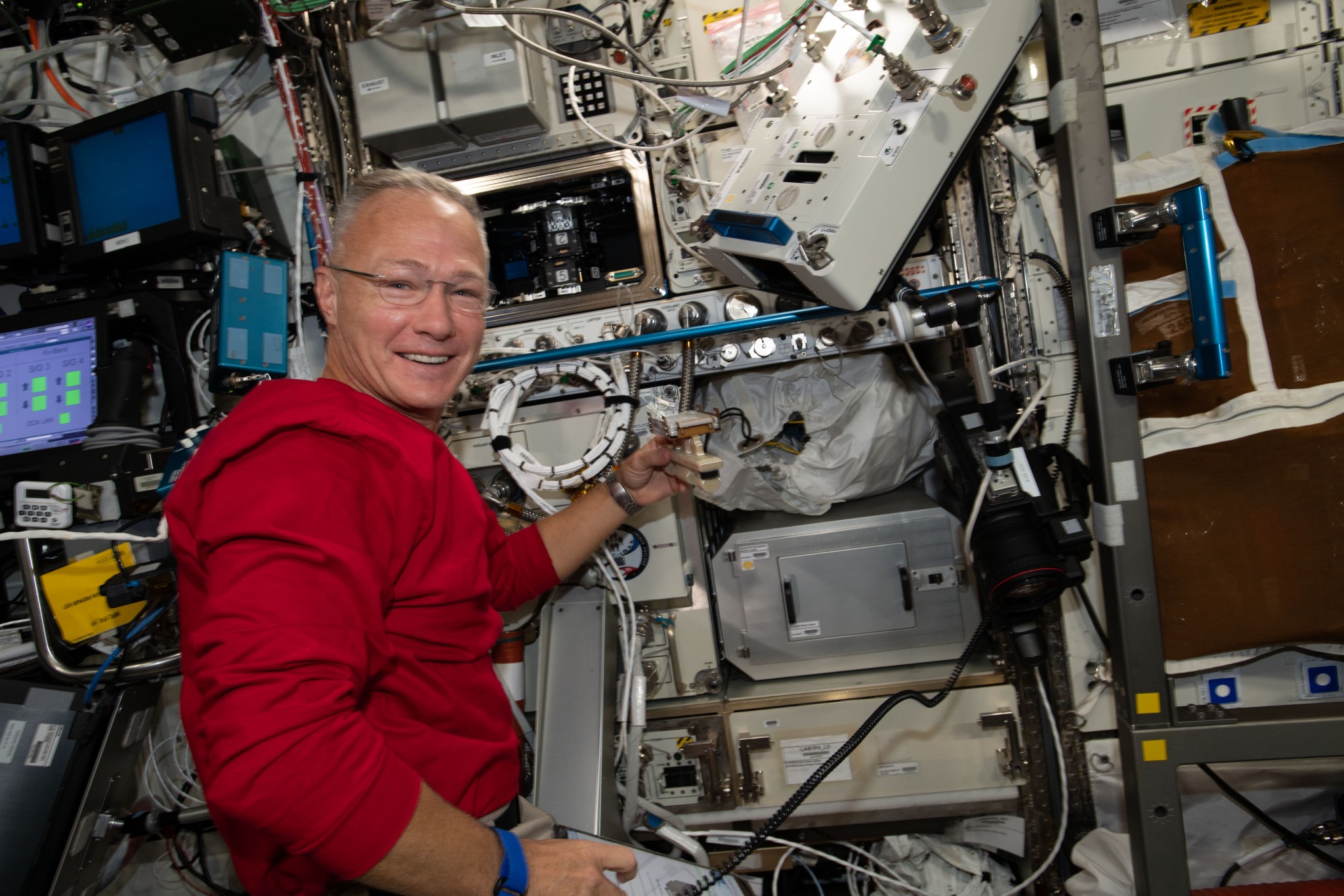 NASA astronaut and Expedition 63 Flight Engineer Doug Hurley works on science hardware inside the International Space Station's U.S. Destiny laboratory. The Multi-use Variable-g Platform is a research facility that can produce up to 2 g of artificial gravity for biological studies of fruit flies, flatworms, plants, fish, cells, protein crystals and many others.