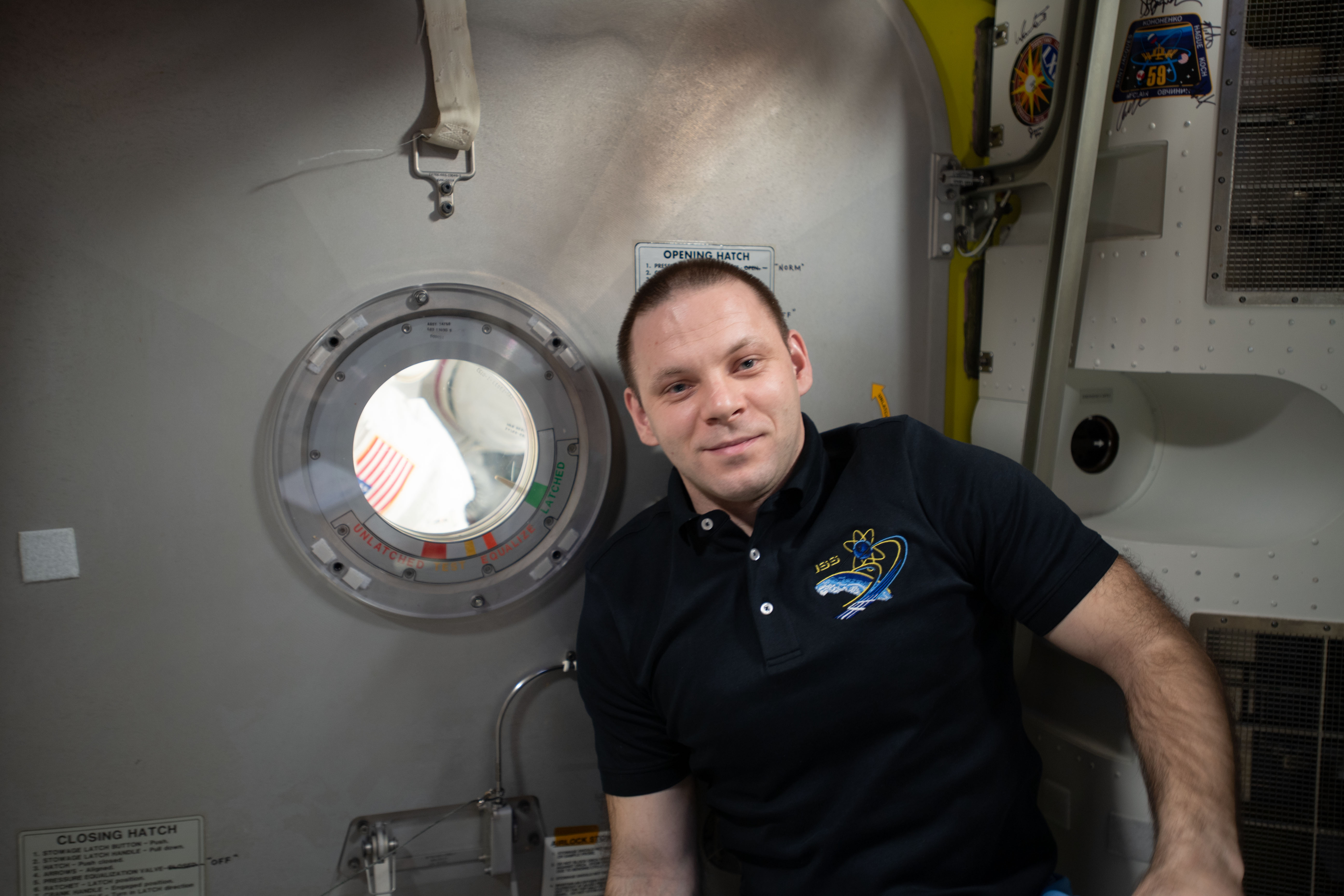 Expedition 63 Flight Engineer Ivan Vagner of Roscosmos is pictured in the Quest airlock after assisting NASA spacewalkers (out of frame) Bob Behnken and Chris Cassidy into the crew lock before their spacewalk on June 26.