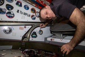 Roscosmos cosmonaut and Expedition 63 Flight Engineer Ivan Vagner signs the vestibule in between the U.S. Harmony module and JAXA's (Japan Aerospace Exploration Agency) H-II Transfer Vehicle-9 (HTV-9). The HTV-9 would later be uninstalled from Harmony before being released it into Earth orbit that day completing an 85-day cargo mission.