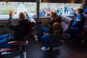 Expedition 63 crewmembers Anatoly Ivanishin, left, Ivan Vagner of Roscosmos, center, and Chris Cassidy of NASA, right, wave farewell as they depart their Cosmonaut Hotel crew quarters in Baikonur, Kazakhstan to travel to their suit up facility for launch on the Soyuz MS-16 rocket from the Baikonur Cosmodrome, Thursday, April 9, 2020. They are beginning a six-and-a-half month mission on the International Space Station.