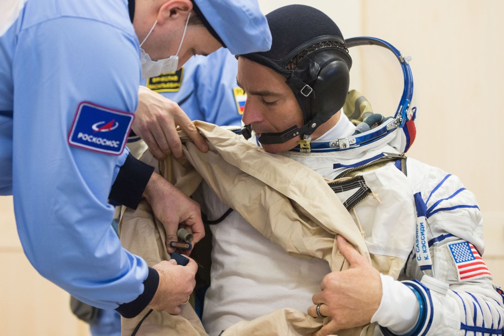 Expedition 63 crewmember Chris Cassidy of NASA dons his Sokol suit a few hours ahead of his launch on a Soyuz rocket with Ivan Vagner and Anatoly Ivanishin of Roscosmos, Thursday, April 9, 2020 at the Baikonur Cosmodrome in Kazakhstan. A few hours later, they lifted off for a six-and-a-half month mission on the International Space Station.