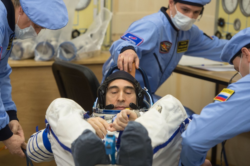Expedition 63 crewmember Anatoly Ivanishin of Roscosmos has his Sokol suit pressure checked ahead of his launch on a Soyuz rocket with Ivan Vagner of Roscosmos, and Chris Cassidy of NASA, Thursday, April 9, 2020 at the Baikonur Cosmodrome in Kazakhstan. A few hours later, they lifted off for a six-and-a-half month mission on the International Space Station.