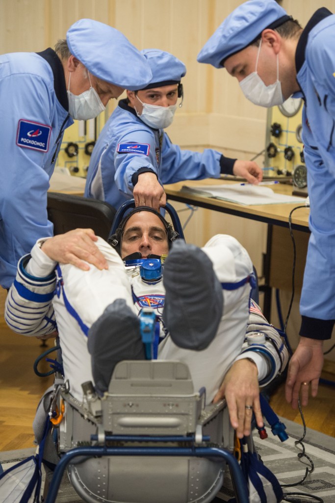 Expedition 63 crewmember Chris Cassidy of NASA has his Sokol suit pressure checked ahead of his launch on a Soyuz rocket with Anatoly Ivanishin and Ivan Vagner of Roscosmos, Thursday, April 9, 2020 at the Baikonur Cosmodrome in Kazakhstan. A few hours later, Vagner, Anatoly Ivanishin of Roscosmos, and Chris Cassidy of NASA lifted off for a six-and-a-half month mission on the International Space Station.