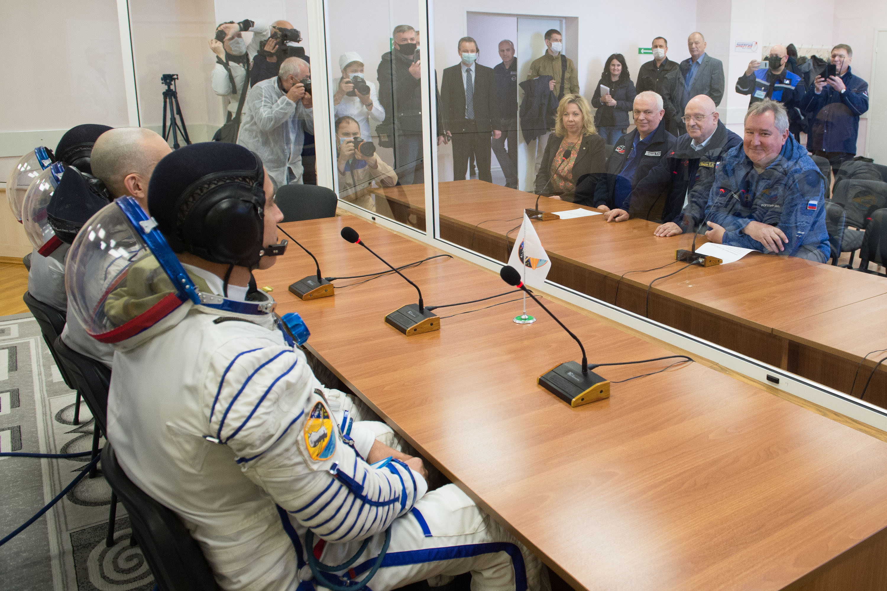 Expedition 63 crewmembers Chris Cassidy of NASA, Anatoly Ivanishin and Ivan Vagner of Roscosmos, talk to Roscosmos Director General Dmitry Rogozin, right, NASA Director for Human Space Flight Programs, Russia, Tricia Mack, left, and other mission managers prior to departing for the launch pad, Thursday, April 9, 2020 at the Baikonur Cosmodrome in Kazakhstan. A few hours later, they lifted off on a Soyuz rocket for a six-and-a-half month mission on the International Space Station.