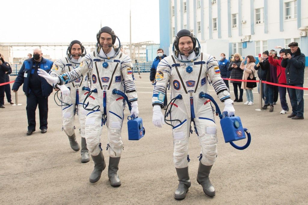 Expedition 63 crewmembers Chris Cassidy of NASA, left, Anatoly Ivanishin, center, and Ivan Vagner of Roscosmos, depart building 254 for the launch pad, Thursday, April 9, 2020 at the Baikonur Cosmodrome in Kazakhstan. A few hours later, they lifted off on a Soyuz rocket for a six-and-a-half month mission on the International Space Station.