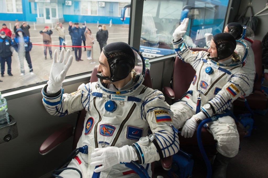 Expedition 63 crewmembers Anatoly Ivanishin, left, Ivan Vagner of Roscosmos, center, and Chris Cassidy of NASA depart building 254 via bus for the launch pad, Thursday, April 9, 2020 at the Baikonur Cosmodrome in Kazakhstan. A few hours later, they lifted off on a Soyuz rocket for a six-and-a-half month mission on the International Space Station.