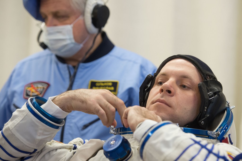Expedition 63 crewmember Ivan Vagner of Roscosmos dons his Sokol suit a few hours ahead of his launch on a Soyuz rocket with Anatoly Ivanishin of Roscosmos, and Chris Cassidy of NASA, Thursday, April 9, 2020 at the Baikonur Cosmodrome in Kazakhstan. A few hours later, they lifted off for a six-and-a-half month mission on the International Space Station.
