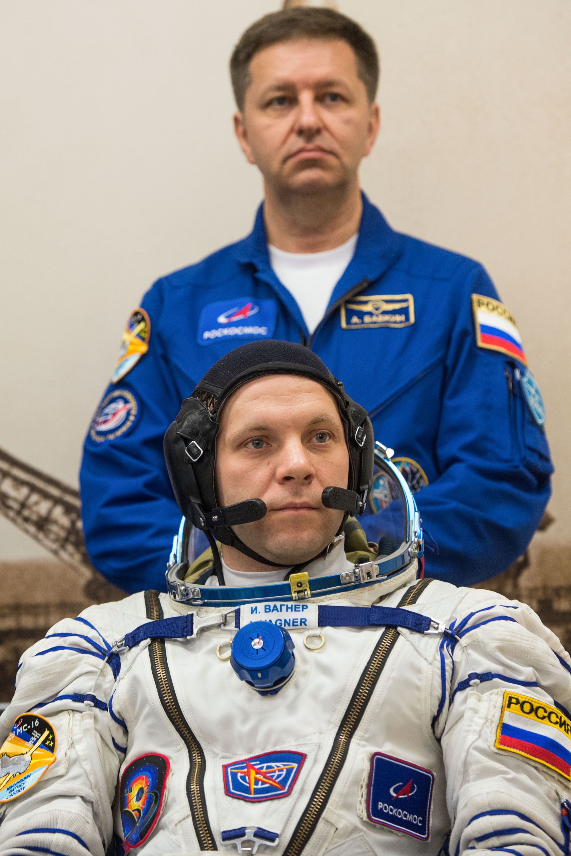 Expedition 63 crewmember Ivan Vagner of Roscosmos, foreground, waits to have his Sokol suit pressure checked, as backup crew member Andrei Babkin of Roscosmos looks on, Thursday, April 9, 2020 at the Baikonur Cosmodrome in Kazakhstan. A few hours later, Vagner, Anatoly Ivanishin of Roscosmos, and Chris Cassidy of NASA lifted off for a six-and-a-half month mission on the International Space Station.