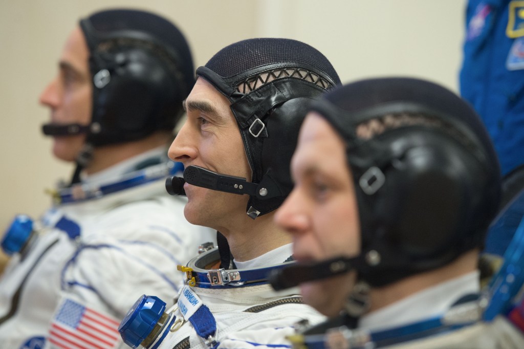 Expedition 63 crewmembers Chris Cassidy of NASA, left, Anatoly Ivanishin and Ivan Vagner of Roscosmos, right, talk to mission managers prior to departing for the launch pad, Thursday, April 9, 2020 at the Baikonur Cosmodrome in Kazakhstan. A few hours later, they lifted off on a Soyuz rocket for a six-and-a-half month mission on the International Space Station.