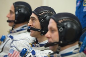 Expedition 63 crewmembers Chris Cassidy of NASA, left, Anatoly Ivanishin and Ivan Vagner of Roscosmos, right, talk to mission managers prior to departing for the launch pad, Thursday, April 9, 2020 at the Baikonur Cosmodrome in Kazakhstan. A few hours later, they lifted off on a Soyuz rocket for a six-and-a-half month mission on the International Space Station.