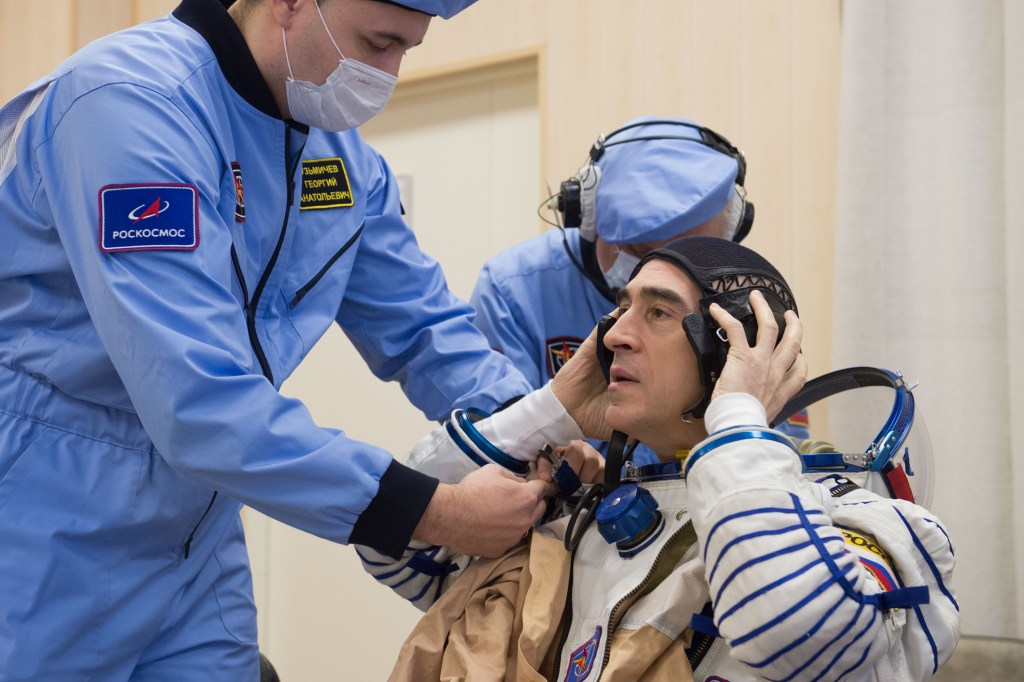 Expedition 63 crewmember Anatoly Ivanishin of Roscosmos dons his Sokol suit a few hours ahead of his launch on a Soyuz rocket with Ivan Vagner of Roscosmos, and Chris Cassidy of NASA, Thursday, April 9, 2020 at the Baikonur Cosmodrome in Kazakhstan. A few hours later, they lifted off for a six-and-a-half month mission on the International Space Station.