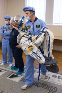 A technician prepares to help Expedition 63 crewmember Chris Cassidy of NASA don his Sokol Suit a few hours ahead of his launch on a Soyuz rocket with Ivan Vagner and Anatoly Ivanishin of Roscosmos, Thursday, April 9, 2020 at the Baikonur Cosmodrome in Kazakhstan. A few hours later, they lifted off for a six-and-a-half month mission on the International Space Station.
