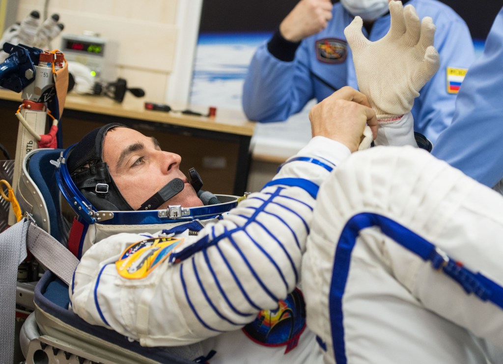 Expedition 63 crewmember Chris Cassidy of NASA has his Sokol suit pressure checked ahead of his launch on a Soyuz rocket with Anatoly Ivanishin and Ivan Vagner of Roscosmos, Thursday, April 9, 2020 at the Baikonur Cosmodrome in Kazakhstan. A few hours later, Vagner, Anatoly Ivanishin of Roscosmos, and Chris Cassidy of NASA lifted off for a six-and-a-half month mission on the International Space Station.